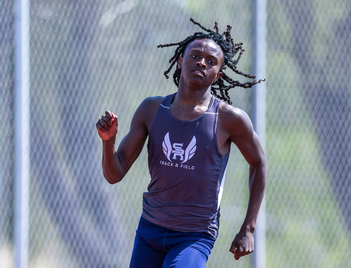 Shadow Ridge's Kamari Mingo turns the corner in the varsity boys 400 meters race during the 202 ...