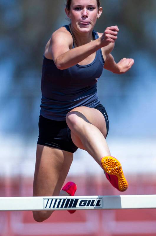 Foothill's Sydney Gibson concentrates on getting over the last hurdle to win in the varsity gir ...