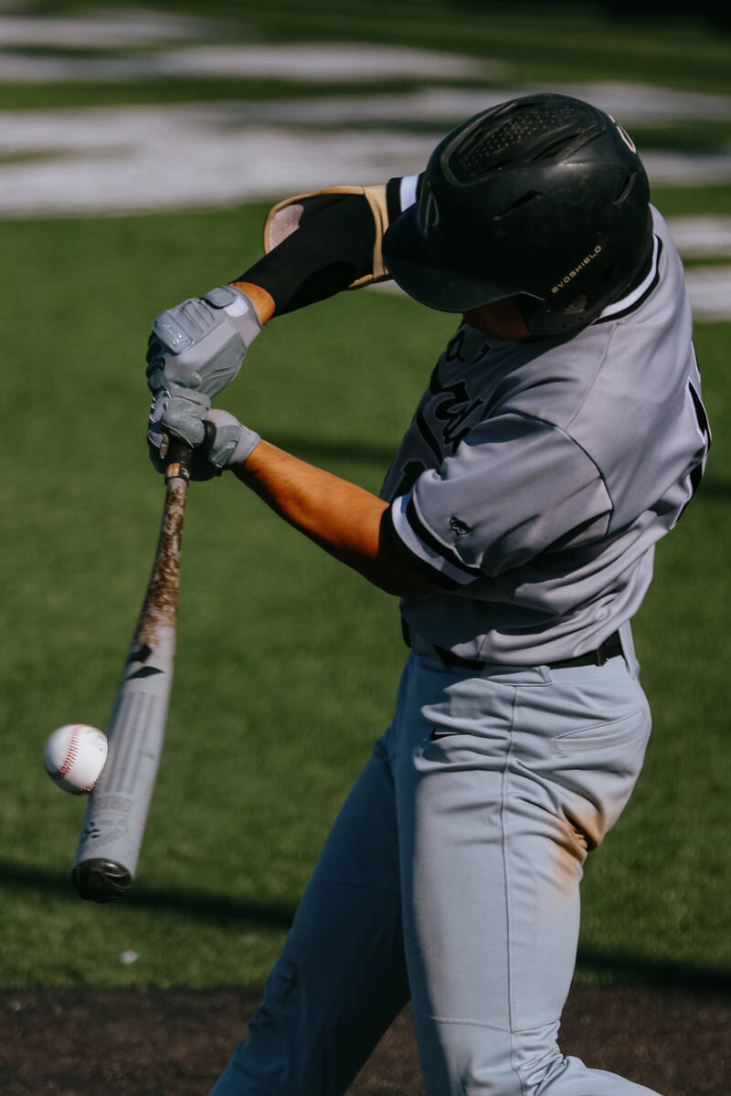 Palo Verde hitter Dane Keener (11) connects with the ball at bat during the baseball game again ...