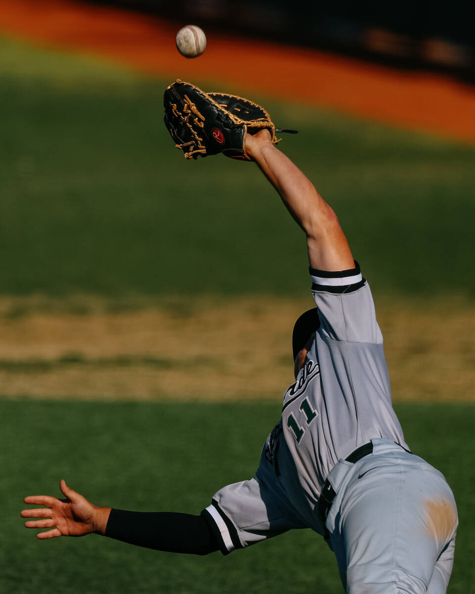 Palo Verde first baseman Dane Keener (11) leaps to catch a foul ball during the baseball game a ...