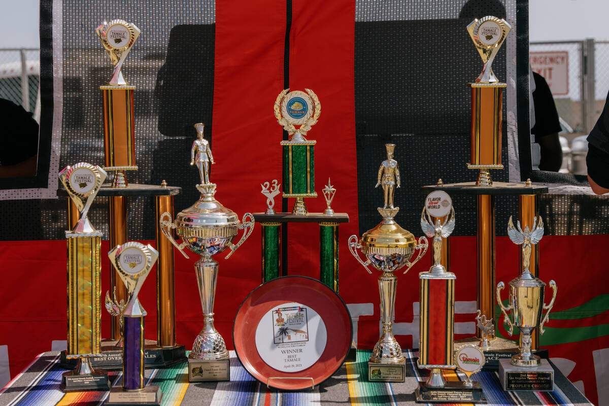 Trophies for best tamales sit outside of The Original Tamale Co’s food booth during the ...