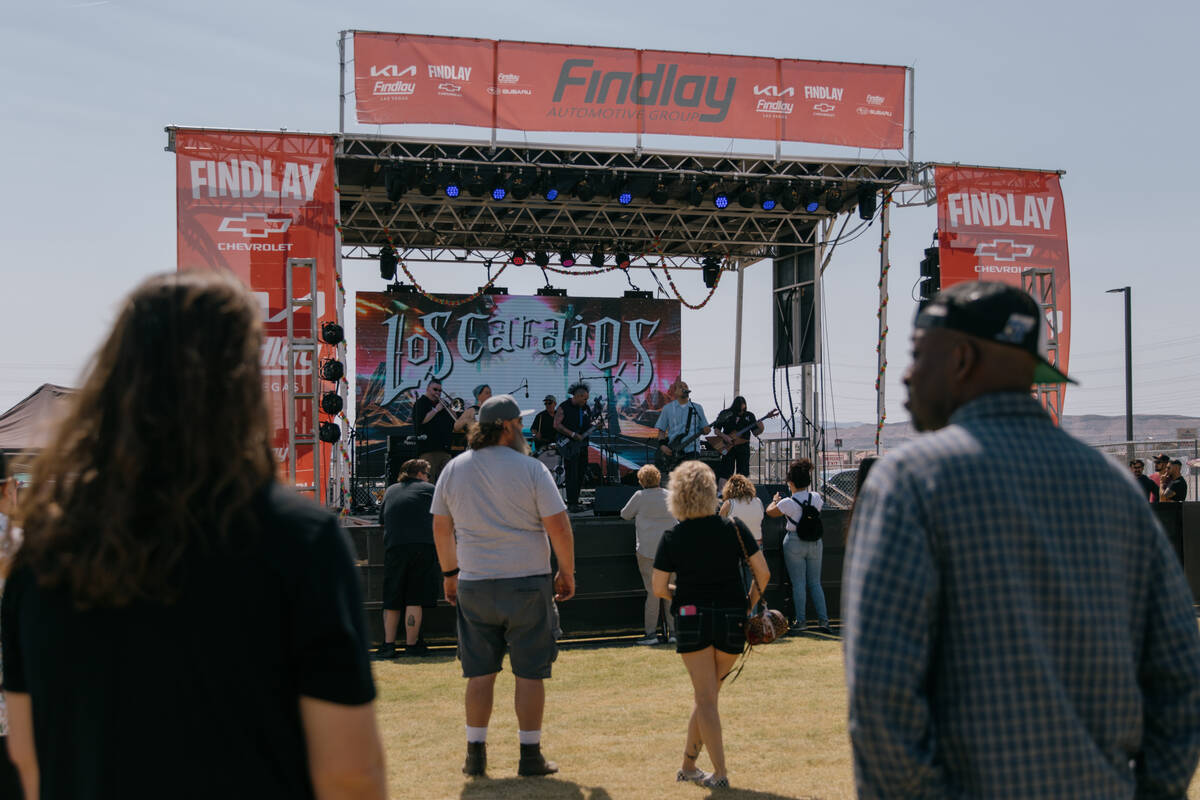 A small crowd gathers to watch Los Carajos perform at the Tacos and Tamales Festival on Saturda ...