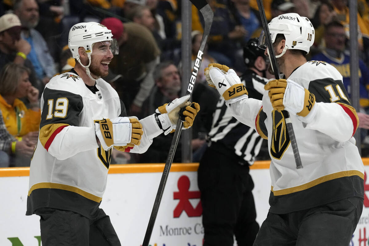 Vegas Golden Knights right wing Reilly Smith (19) celebrates with Nicolas Roy (10) after Smith ...