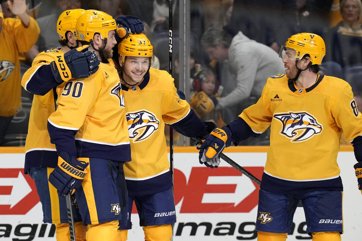 Nashville Predators center Ryan O'Reilly (90) celebrates with Nick Blankenburg (37) and Jonatha ...