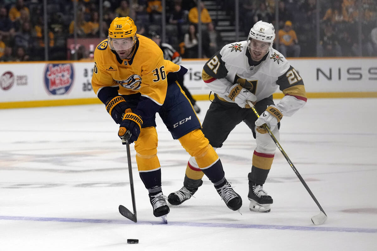 Nashville Predators left wing Cole Smith (36) moves the puck ahead of Vegas Golden Knights cent ...