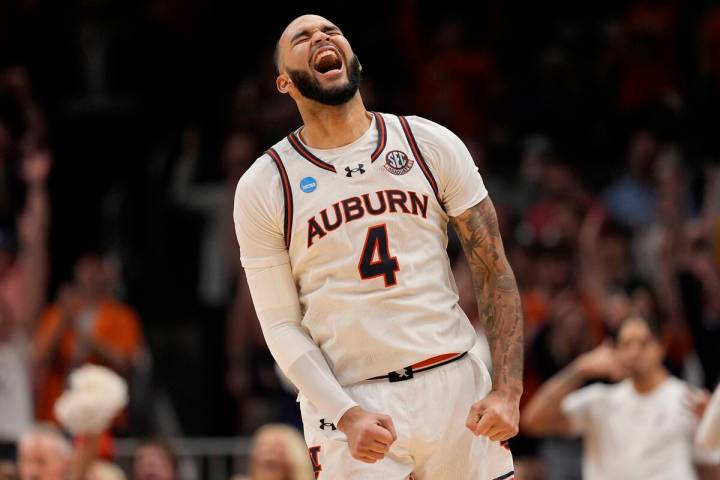 Auburn forward Johni Broome (4) reacts to play against Michigan State during the second half in ...