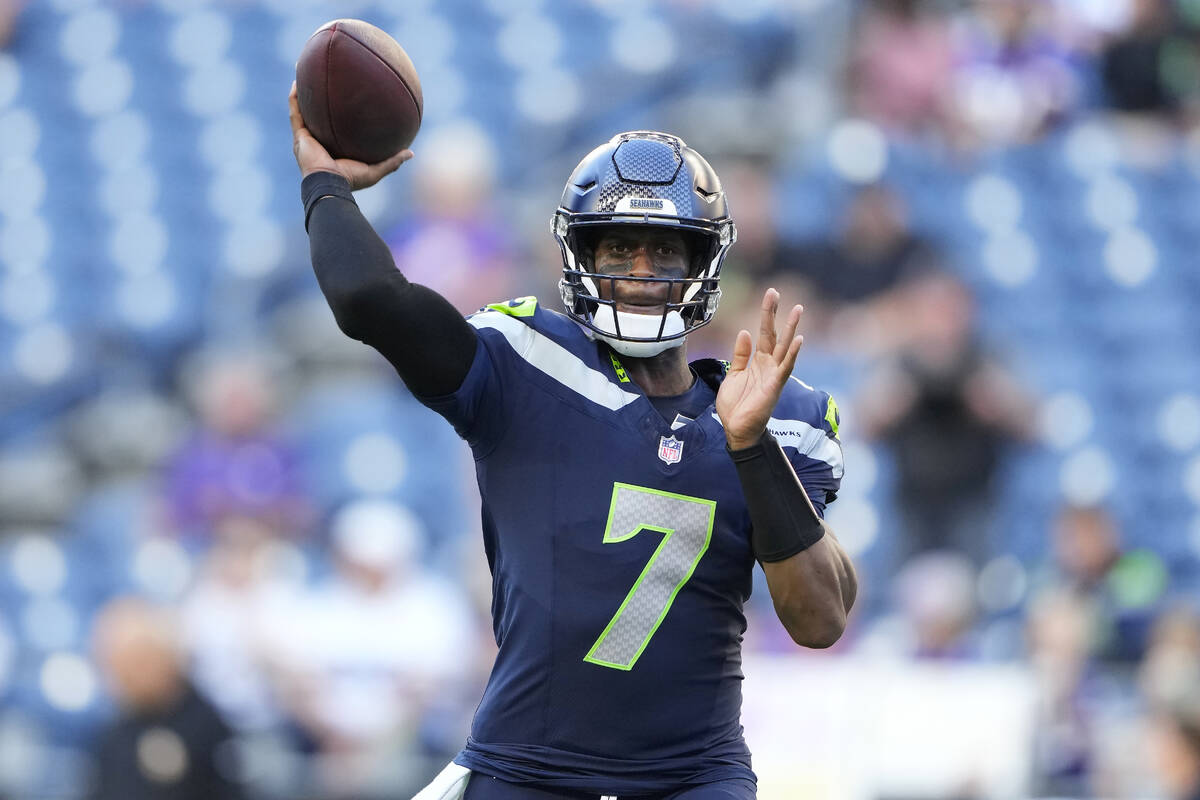 Seattle Seahawks quarterback Geno Smith (7) warms up before an NFL preseason football game agai ...