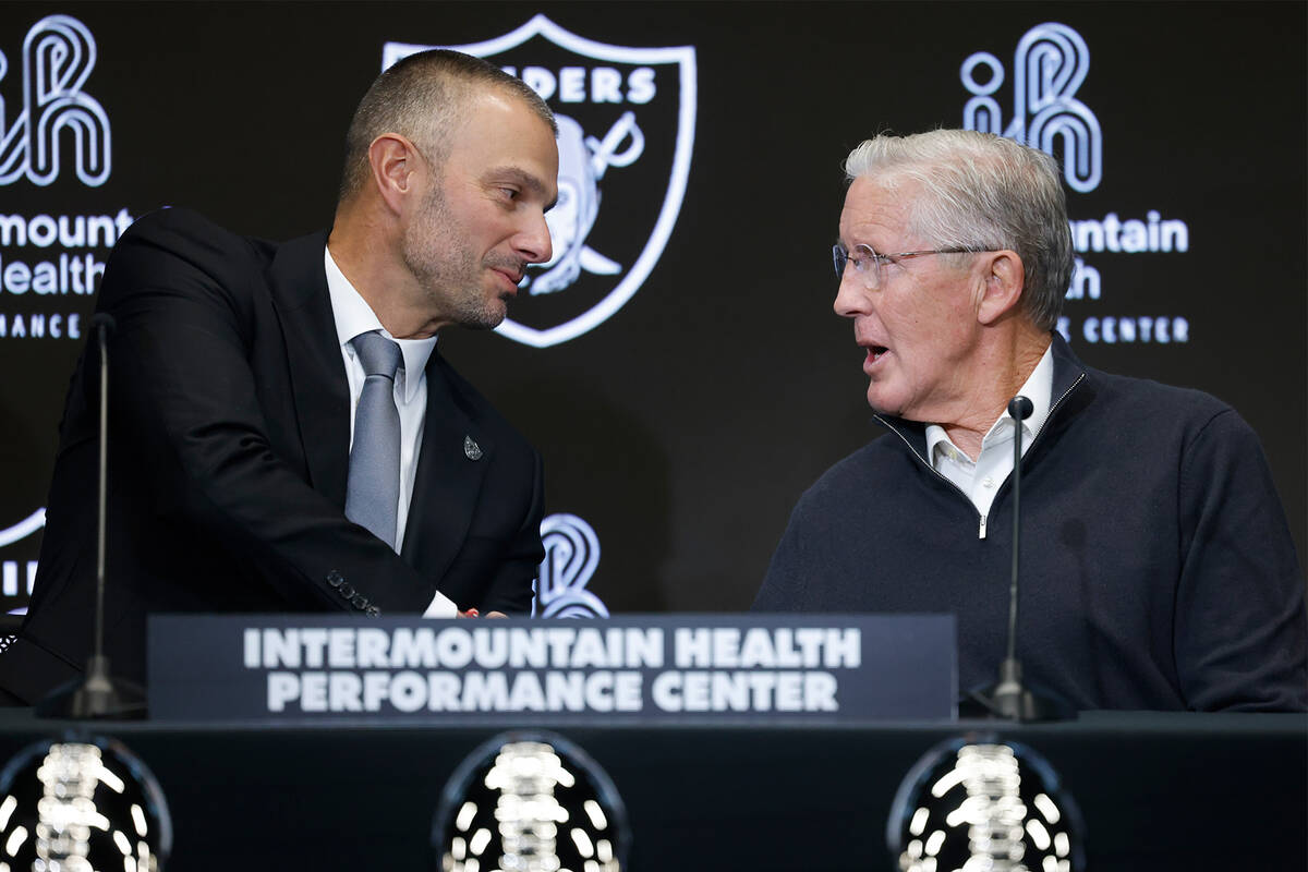 The new Raiders general manager John Spytek, left, and new head coach Pete Carroll shake hands ...