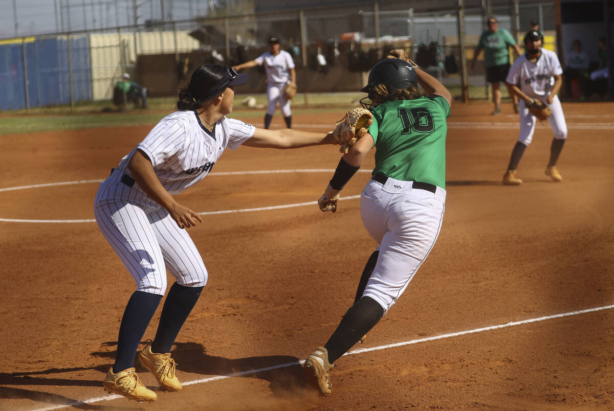 Shadow Ridge's Chloe Covington, left, tags out Palo Verde's Halle Law (16) during a softball ga ...