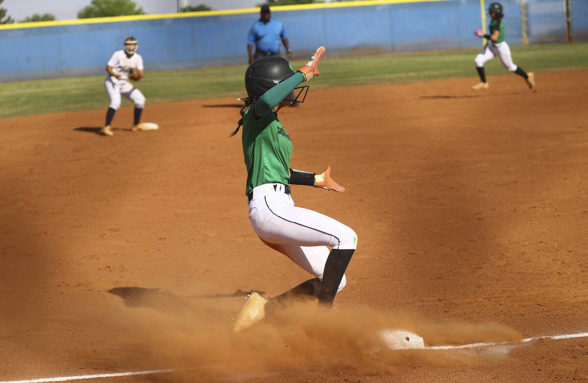 Palo Verde's Sophia Quigley (1) slides into third base during a softball game at Shadow Ridge H ...