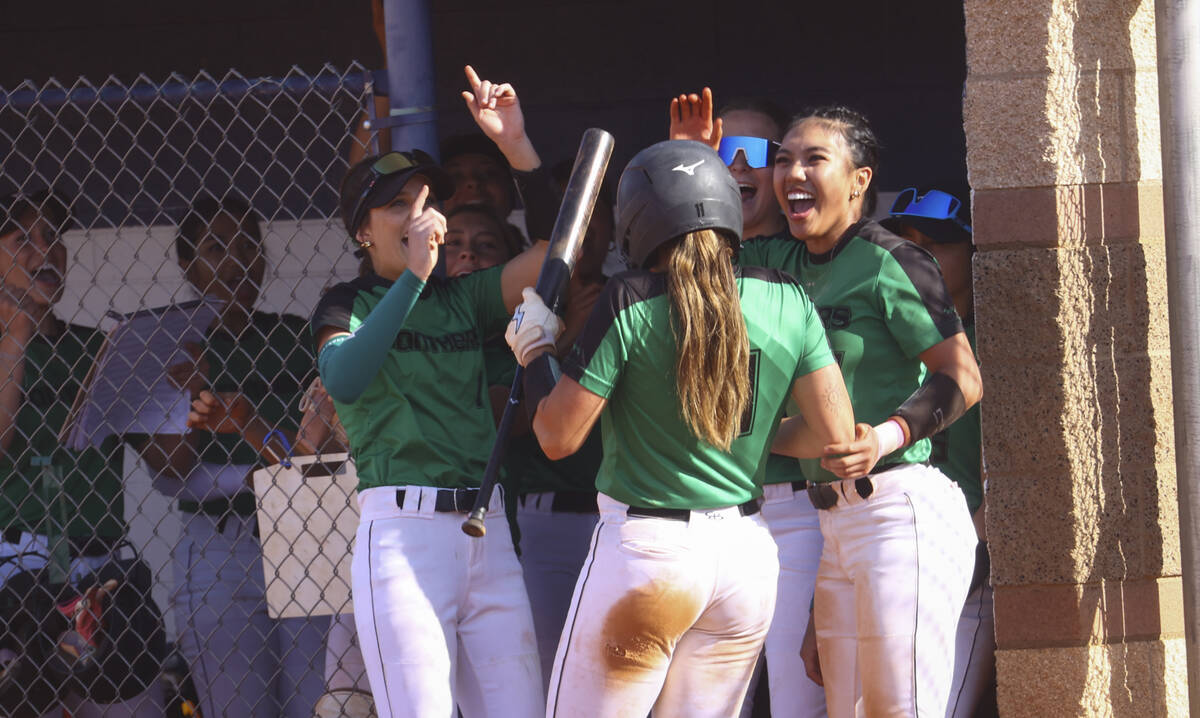 Palo Verde's Taylor Johns (11) celebrates her run with teammates during a softball game at Shad ...