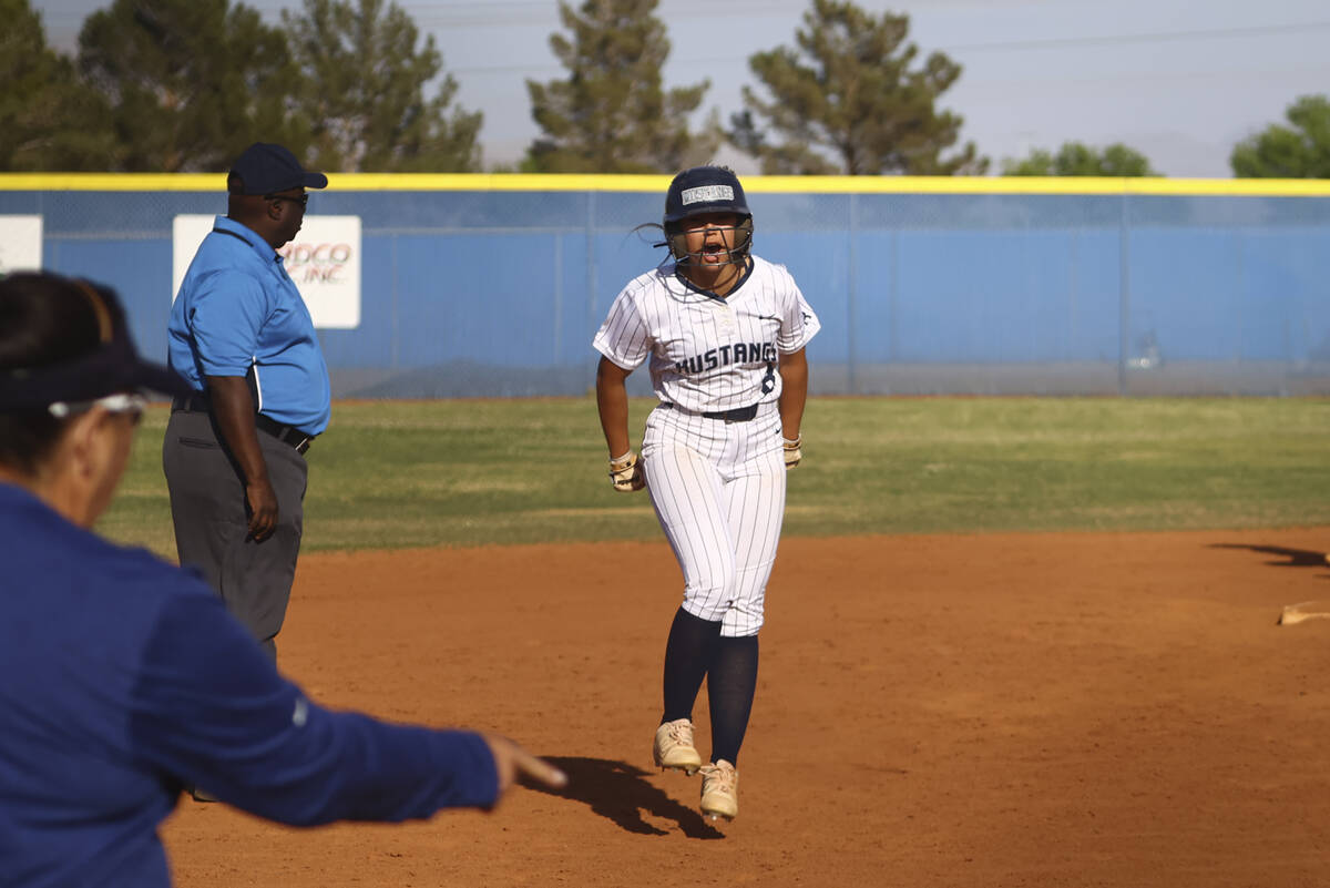 Shadow Ridge's Madelynn Quidato (8) reacts on her way to scoring a run against Palo Verde durin ...