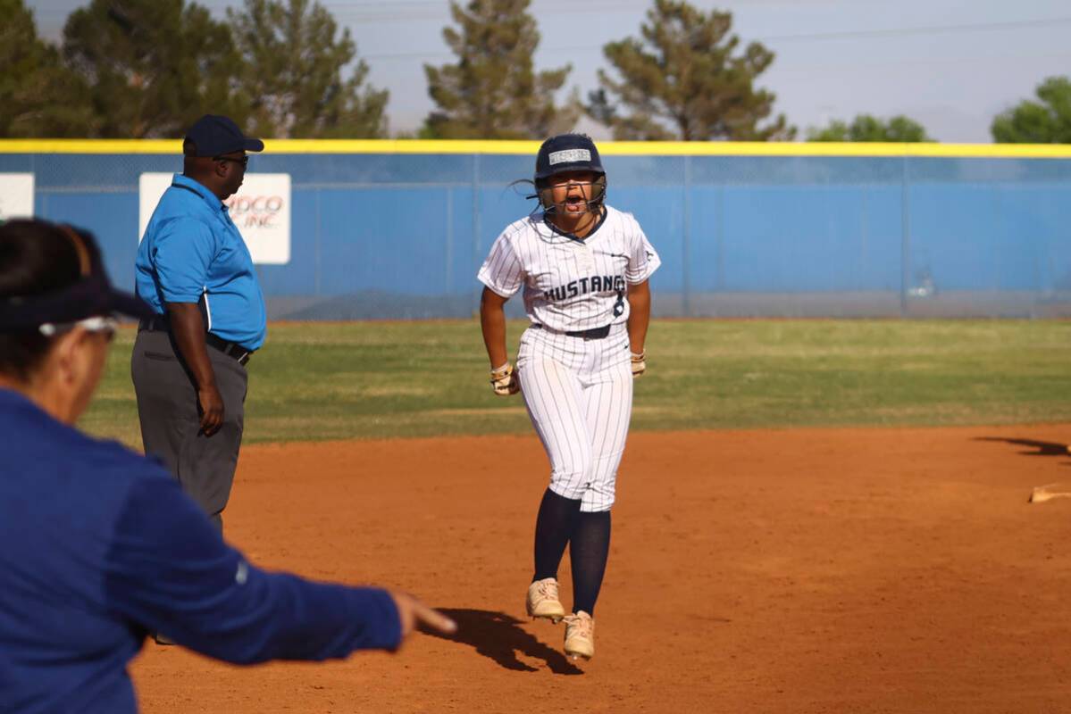 Shadow Ridge's Madelynn Quidato (8) reacts on her way to scoring a run against Palo Verde durin ...