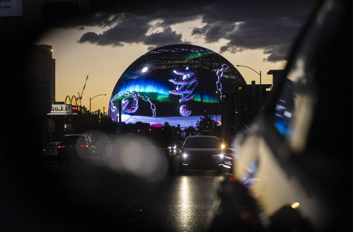 The Sphere is seen reflected in a rearview mirror along Twain Avenue on Monday, March 3, 2025, ...