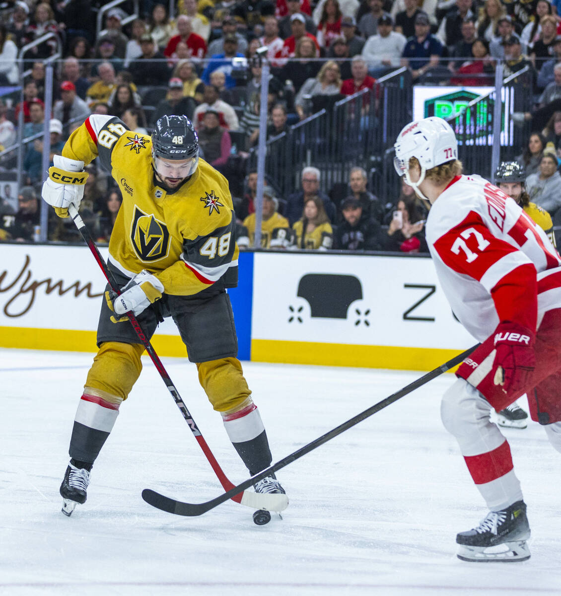 Golden Knights center Tomas Hertl (48) looks to move past Detroit Red Wings defenseman Simon Ed ...