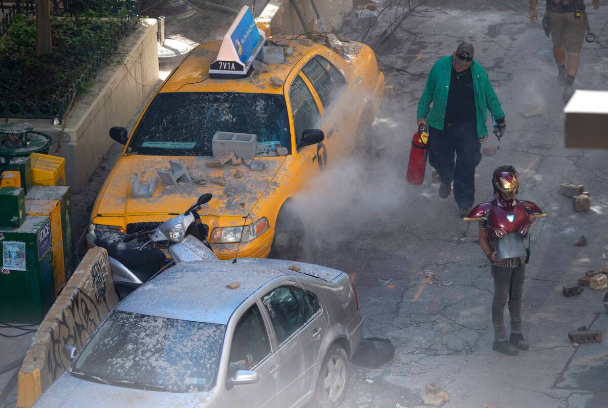 Crew members prepare the set during the filming of "Avengers: Infinity War," Monday, ...