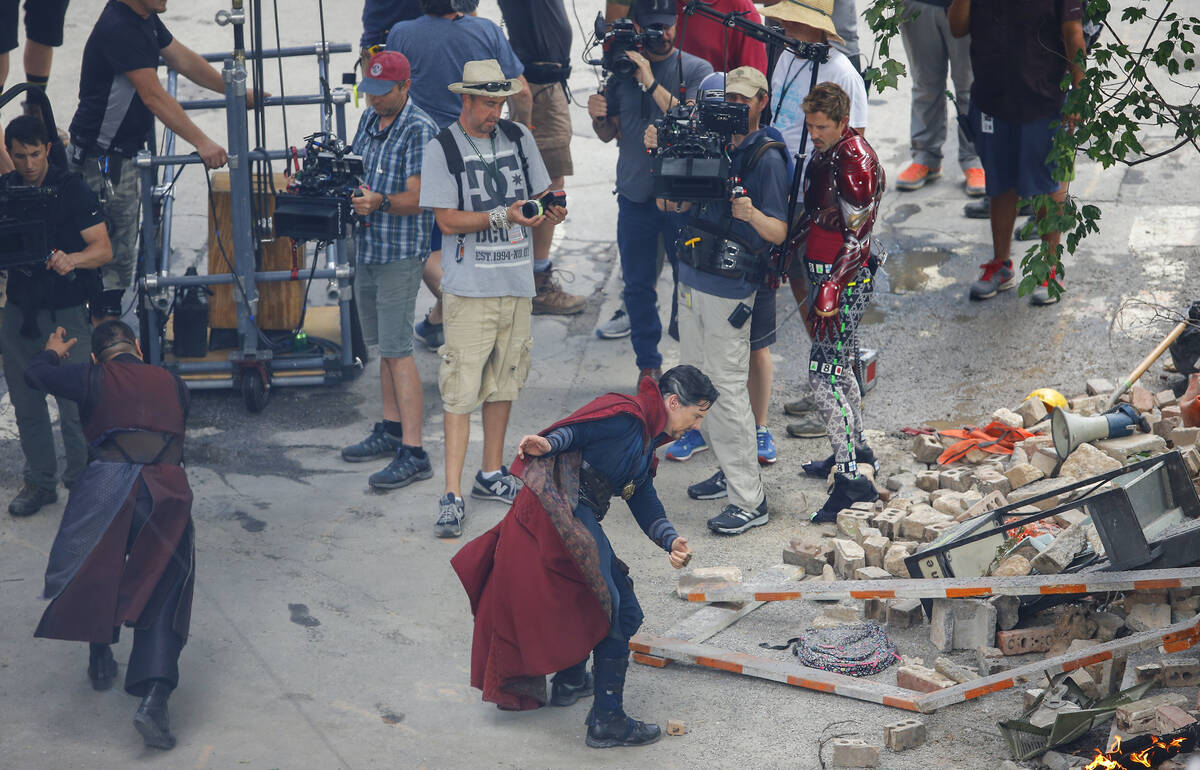 Cast members Benedict Wong and Benedict Cumberbatch, from left, work during the filming of &quo ...