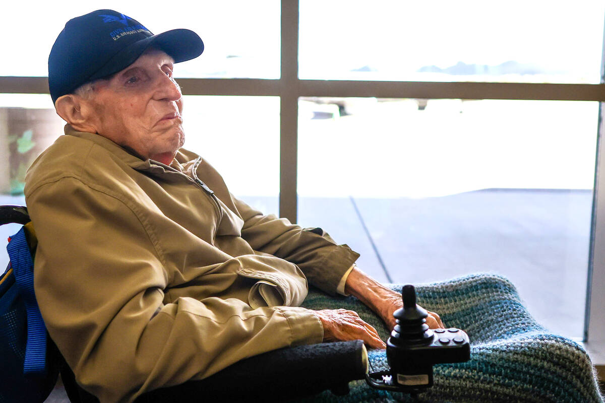 William Brew, a 102-year-old tax preparer, sits beside a window at the Henderson Executive Air ...