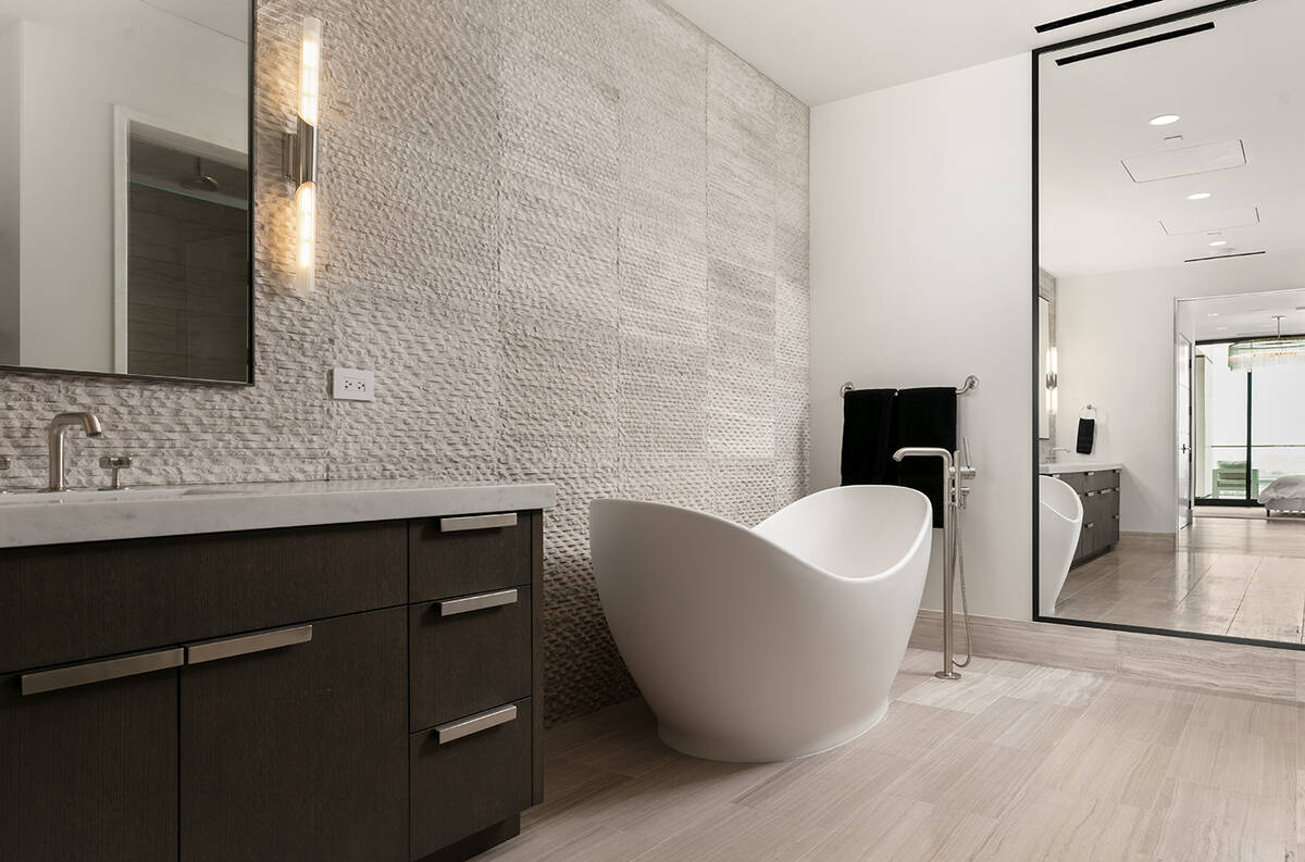 The master bath features a soaking tub. (IS Luxury)