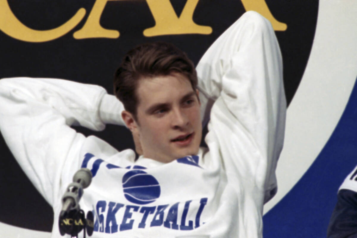Duke's Christian Laettner stretches during a news conference in Indianapolis, Sunday, March 31, ...