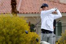 Cameron Combado of Bishop Gorman watches his tee shot on the third hole during the NIAA 5A Moun ...