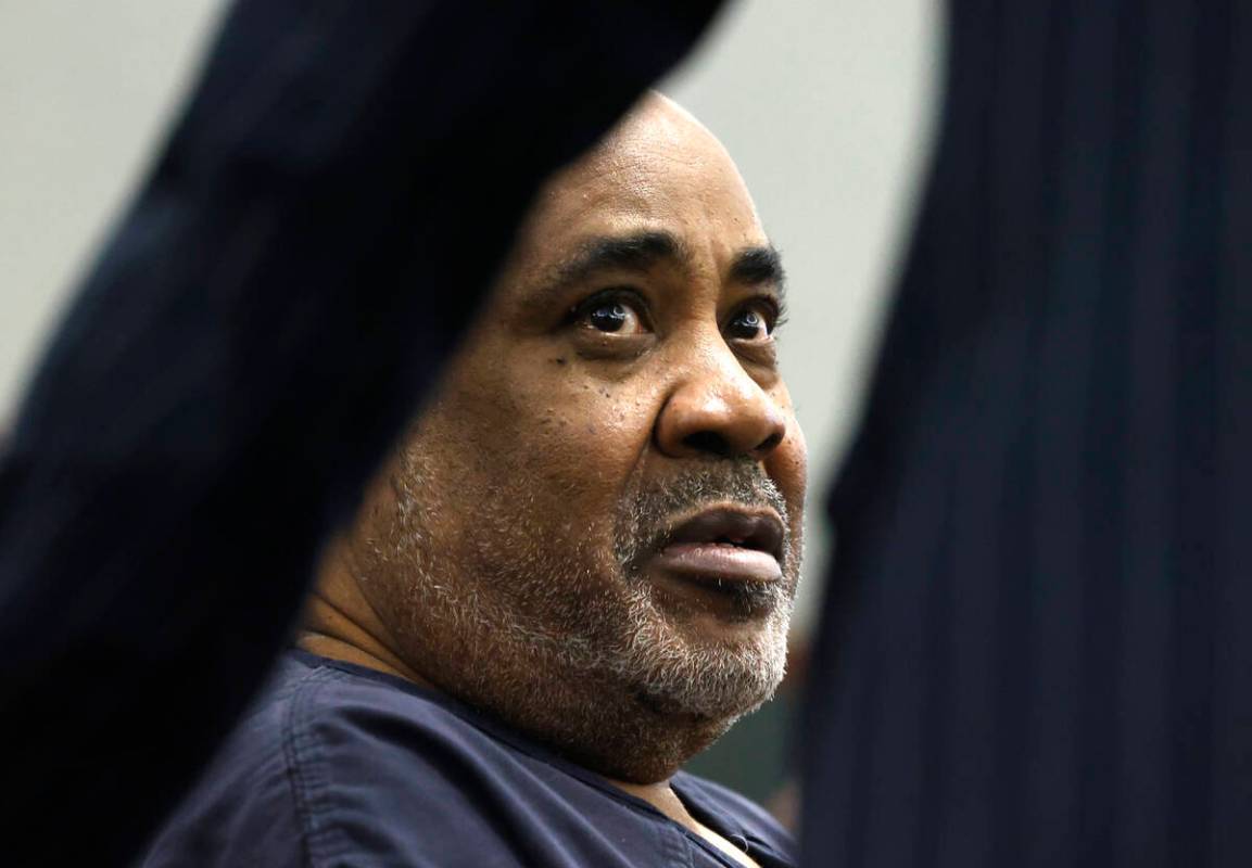Duane Davis, facing murder charges in the killing of rapper Tupac Shakur in 1996, listens to hi ...