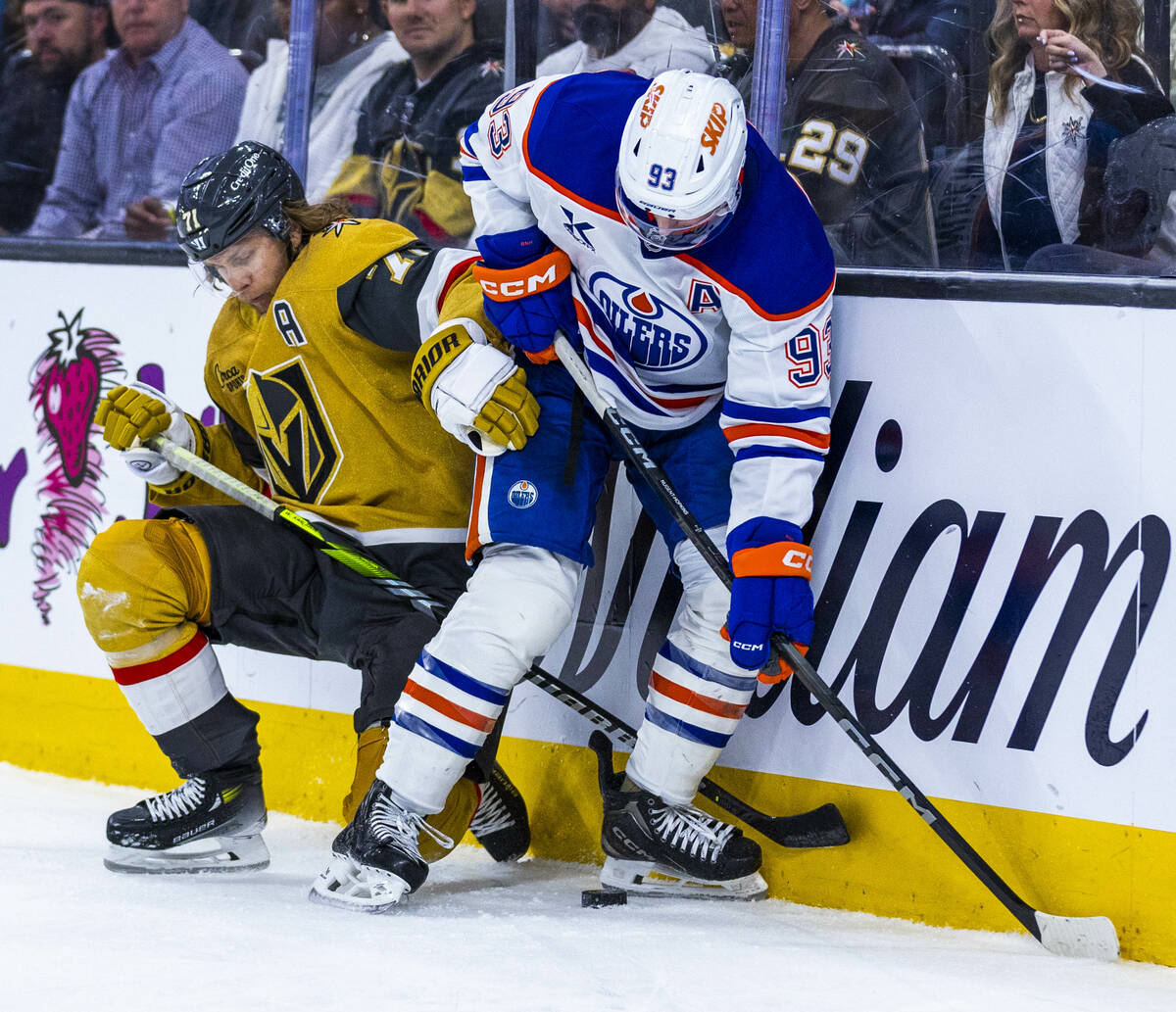 Golden Knights center William Karlsson (71) and Edmonton Oilers center Ryan Nugent-Hopkins (93) ...