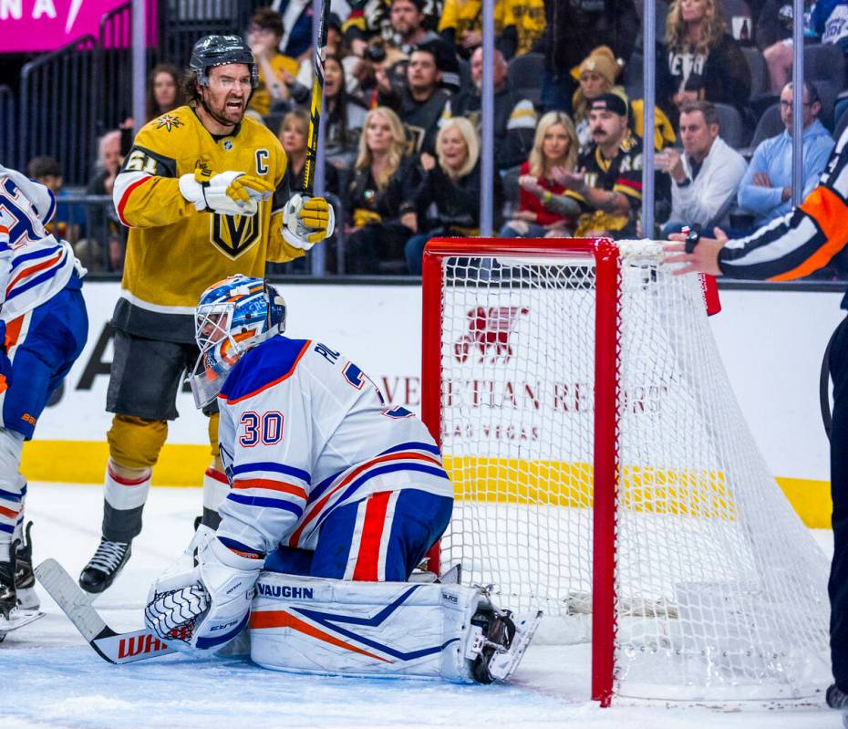 Golden Knights right wing Mark Stone (61) complains to a referee as Edmonton Oilers defenseman ...