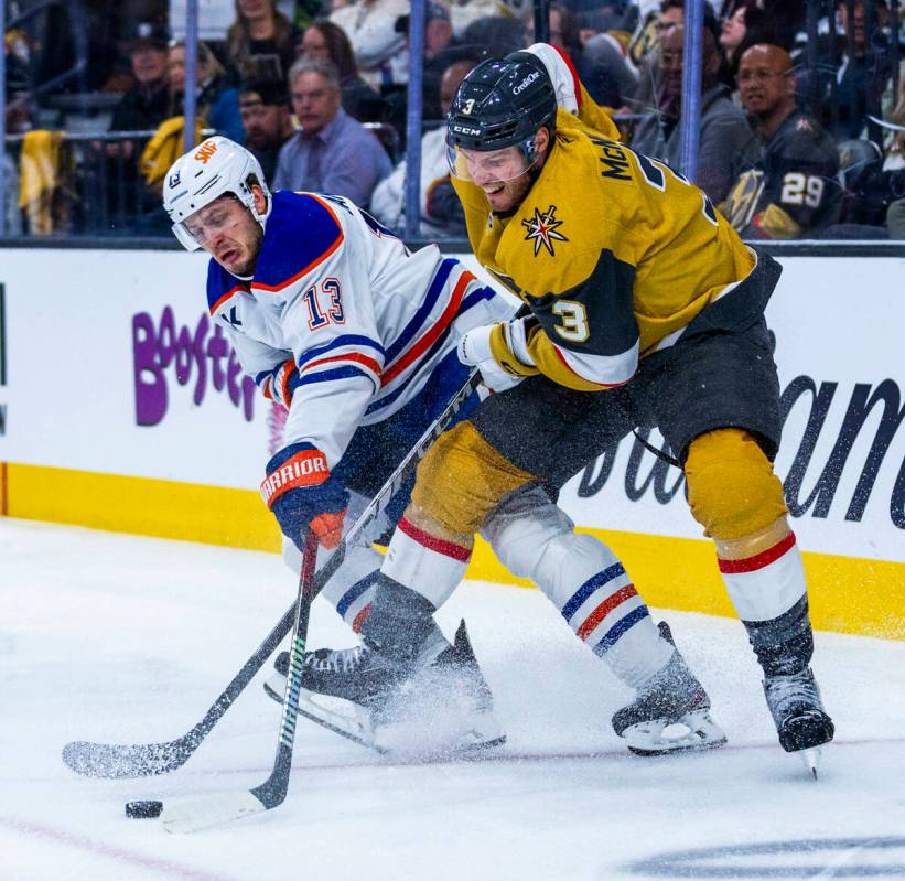 Edmonton Oilers center Mattias Janmark (13) and Golden Knights defenseman Brayden McNabb (3) ba ...