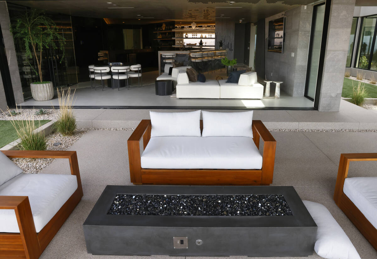 An outdoor patio and a media room at Blue Heron's new home at 8 Chisel Crest Court are seen, on ...