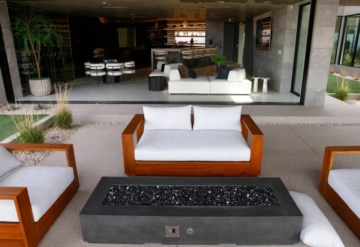 An outdoor patio and a media room at Blue Heron's new home at 8 Chisel Crest Court are seen, on ...