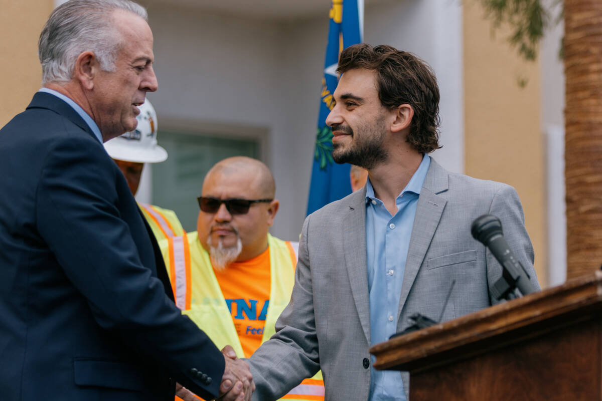 Jess Molasky, COO of Ovation Development and Management Group, shakes welcomes Nevada Governor ...