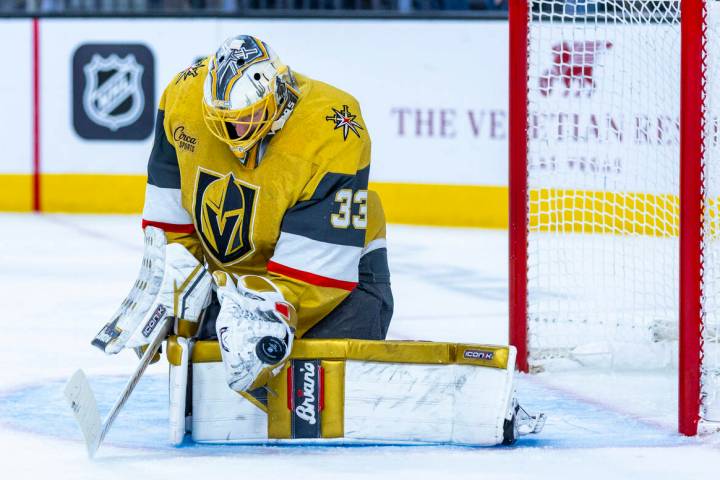 Golden Knights goaltender Adin Hill (33) deflects a shot from the Edmonton Oilers during the se ...