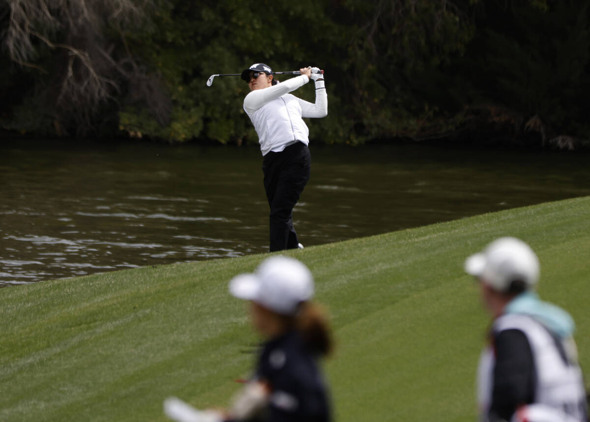 Auston Kim of the USA watches her drive from the fairway to the 2nd hole during the first round ...