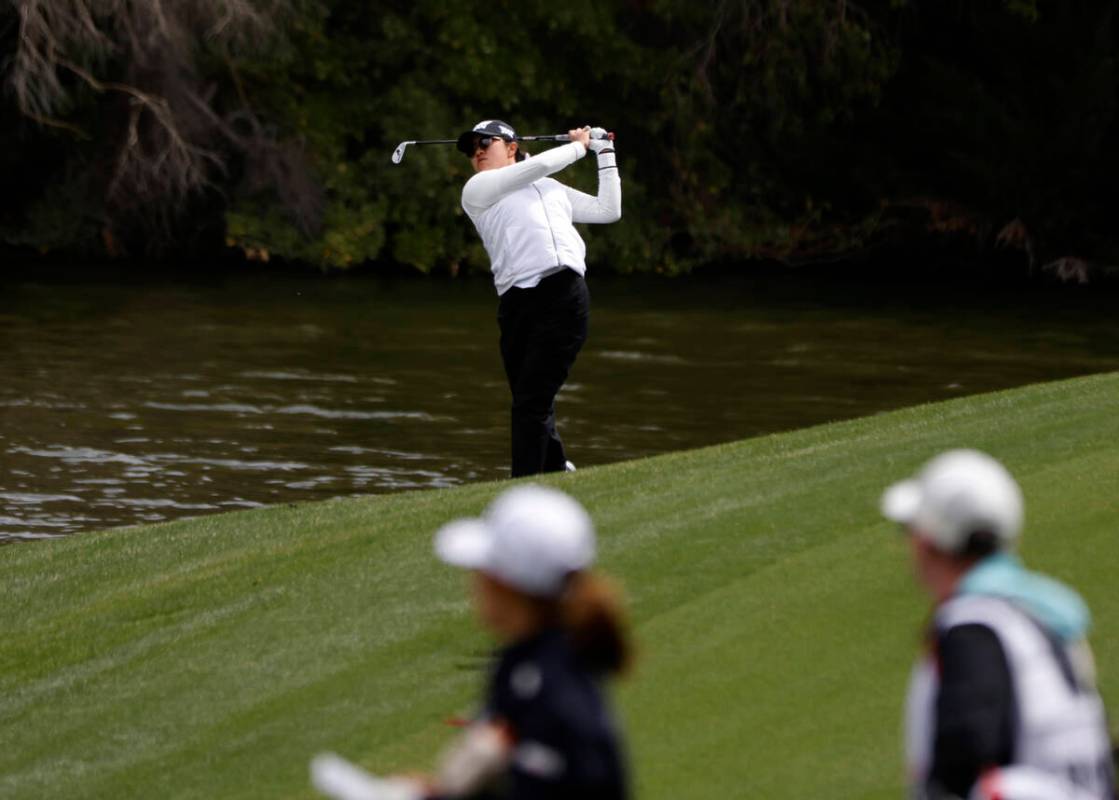 Auston Kim of the USA watches her drive from the fairway to the 2nd hole during the first round ...