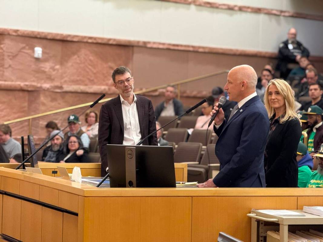 Athletics President Marc Badain (right) speaks as A's vice chairman Sandy Dean looks on during ...