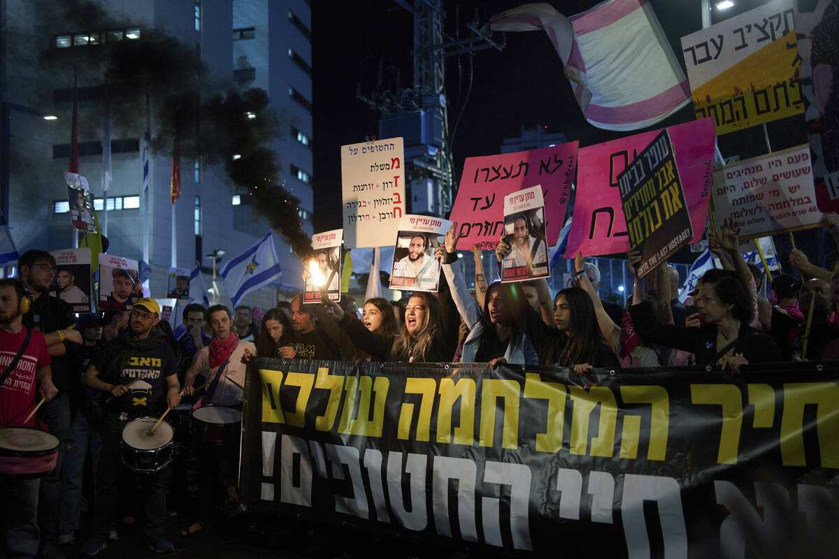 People take part in a protest demanding the immediate release of hostages held by Hamas in the ...