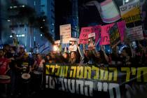 People take part in a protest demanding the immediate release of hostages held by Hamas in the ...