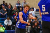 Basic setter Luke Dennett (1) celebrates a point for the Wolves during the volleyball game agai ...