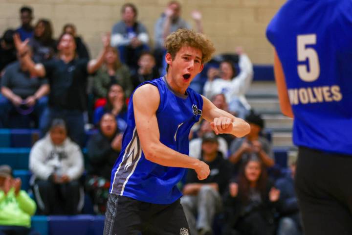Basic setter Luke Dennett (1) celebrates a point for the Wolves during the volleyball game agai ...