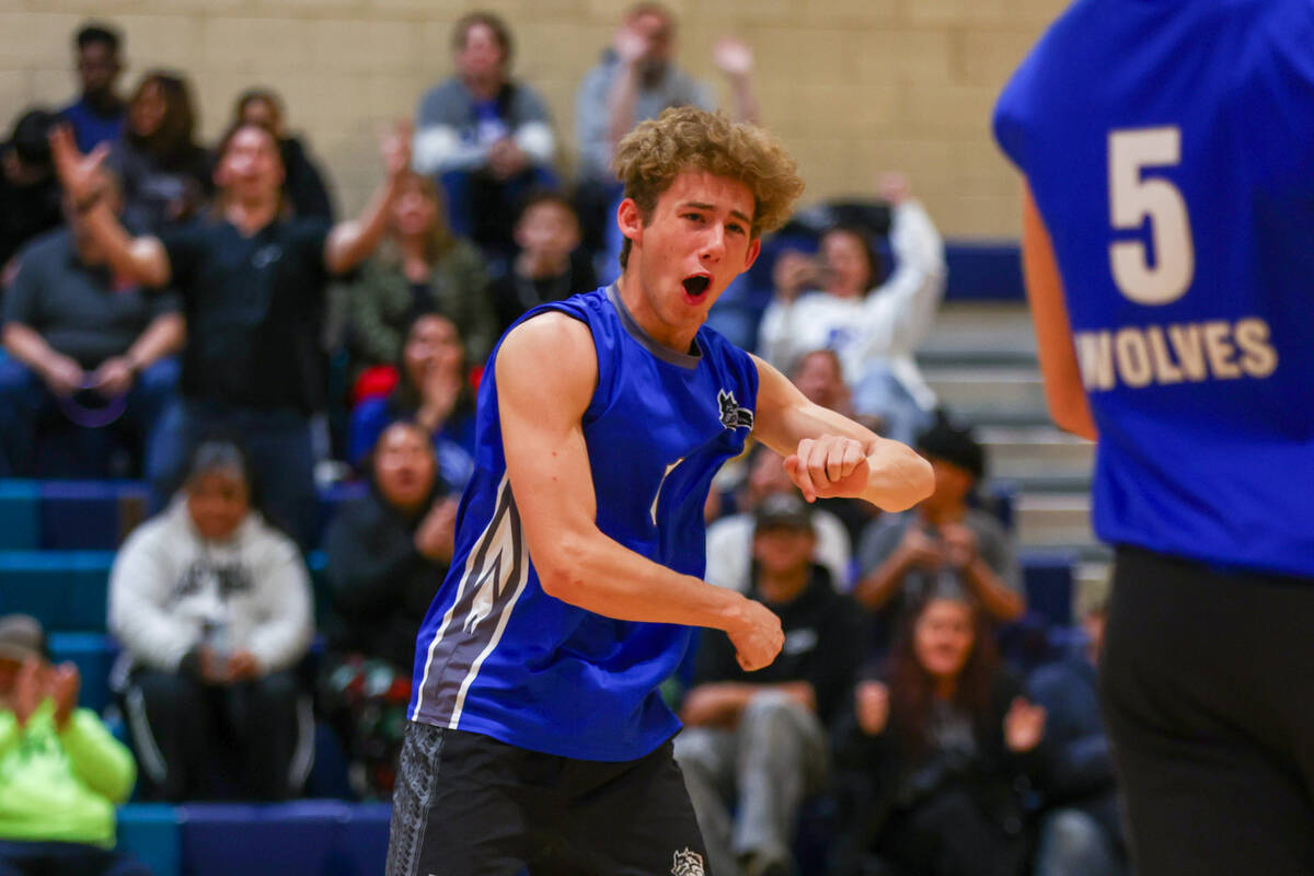 Basic setter Luke Dennett (1) celebrates a point for the Wolves during the volleyball game agai ...