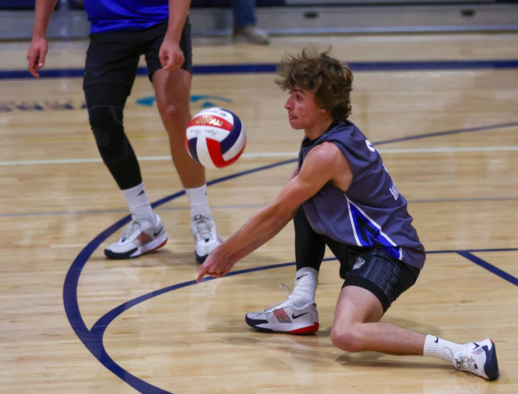 Basic libero Blake Bevell (3) digs a ball from the back row during the volleyball game against ...