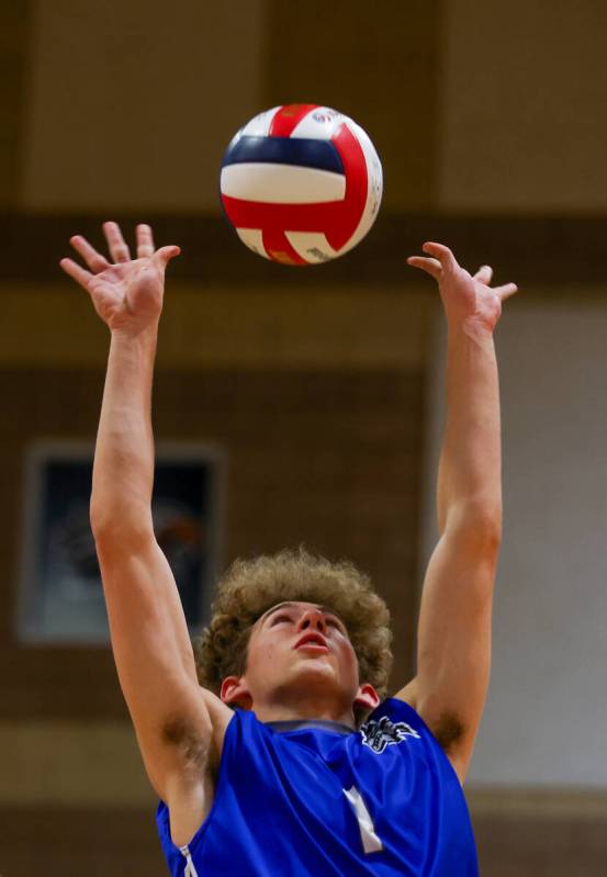 Basic setter Luke Dennett (1) follows through on a set during the volleyball game against Somer ...