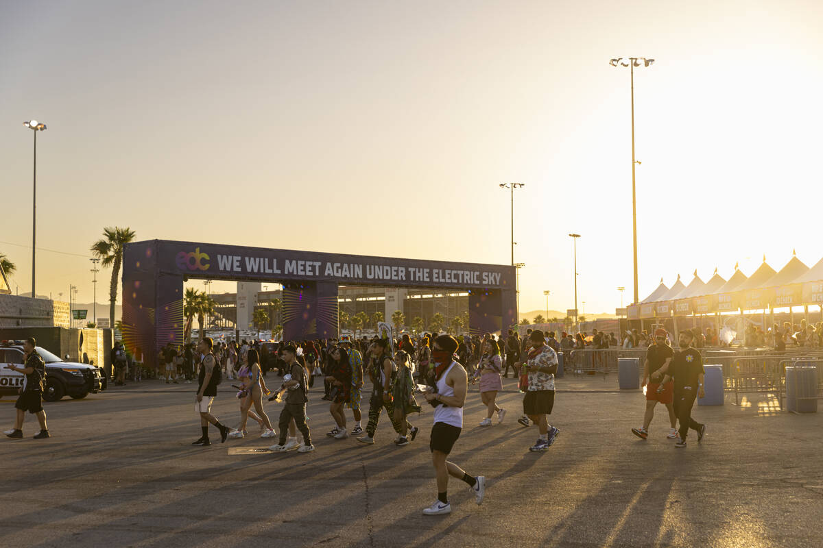 Festival attendees make their way out of the festival just after 6 a.m. following the third and ...