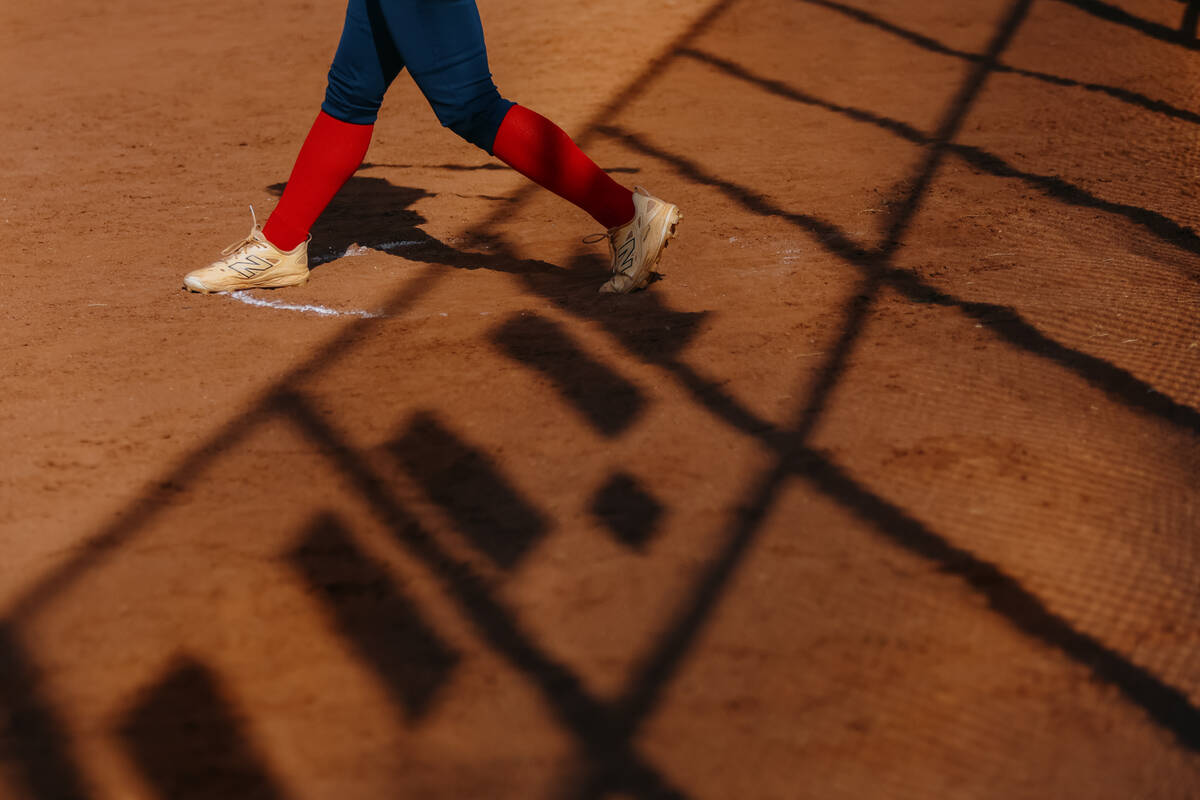 A Coronado hitter practices her swing before coming up to bat during the softball game against ...