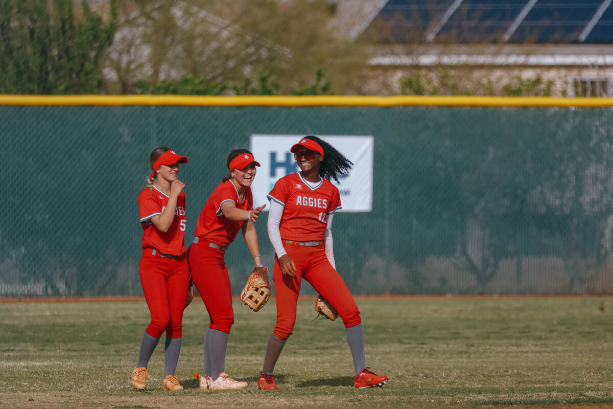 Arbor View outfielders Khloe Beno (51), Breya Her (2) and Malaya Tellis (12) laugh together bet ...