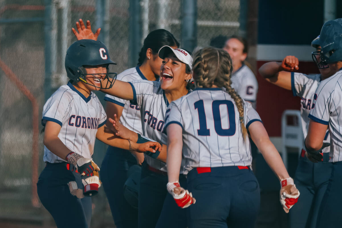 The Coronado Cougars celebrate around teammate Summer Gilliam (3) after her game-winning RBI du ...