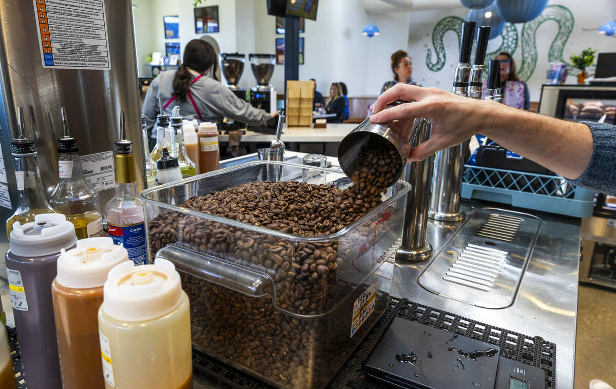 Coffee beans are weighed out at Mothership Coffee Roasters as they are currently absorbing the ...