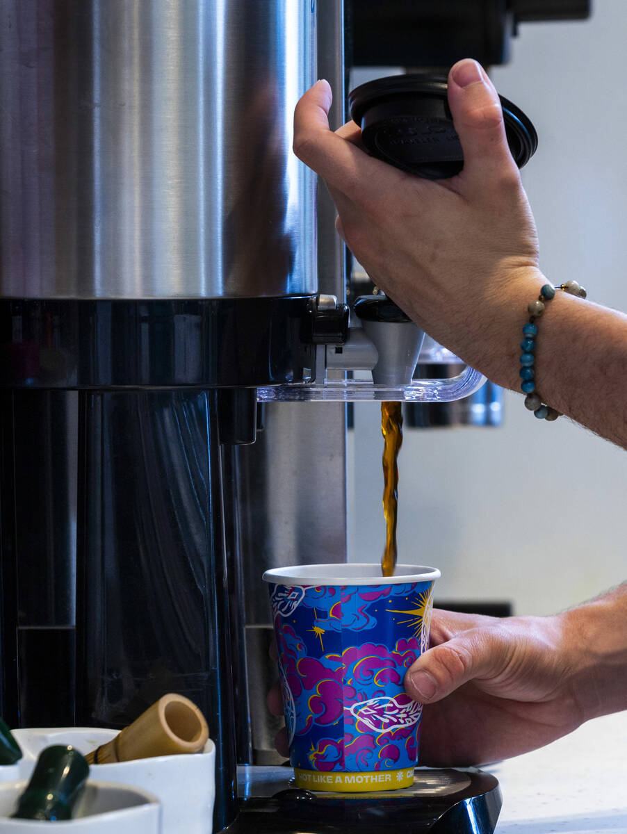 Brewed coffee to go is prepared at Mothership Coffee Roasters as they are currently absorbing t ...