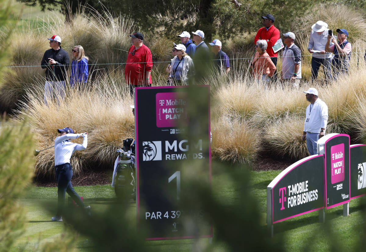 Gaby Lopez, bottom left, of Mexico watches her tee drive as fans follow the ball during the sec ...